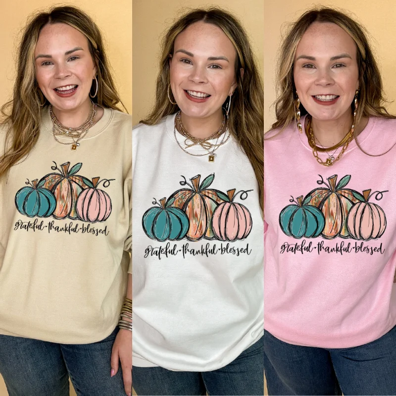 Versatile fashion options for every occasion   Online Exclusive | Grateful, Thankful and Blessed Three Painted Pumpkin Graphic Sweatshirt in Multiple Color Options